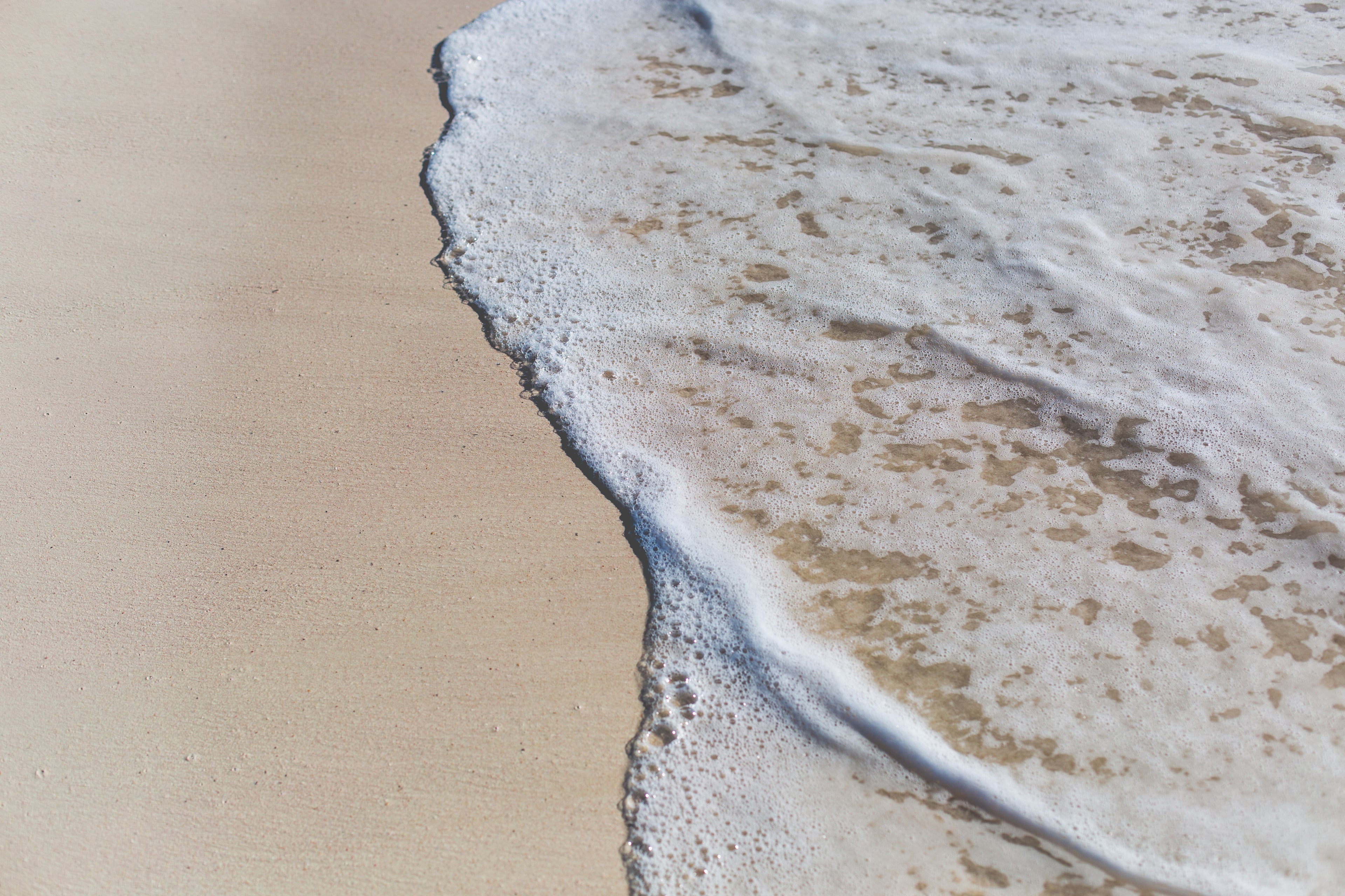 ocean-water-on-beach-sand